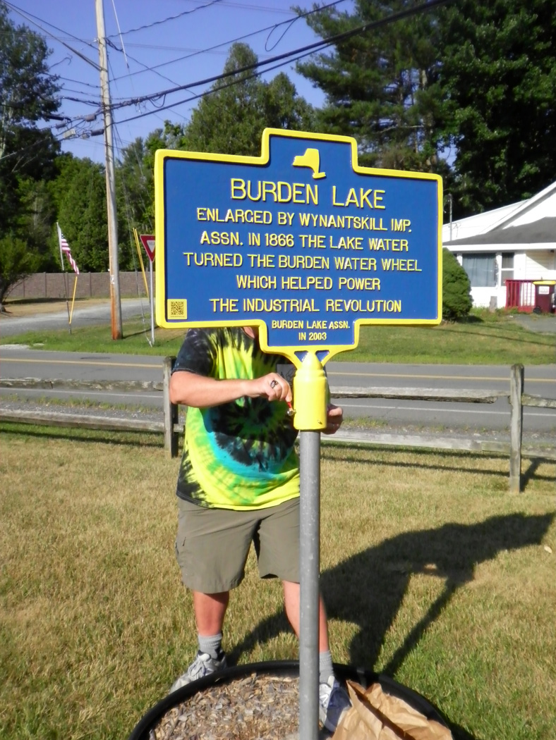 affixing Burden Lake marker to the pole