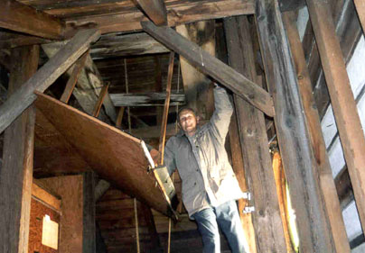 SLHS's own Ross French prepares to climb the tower to view the bell at Zion UCC. Click for a larger image.